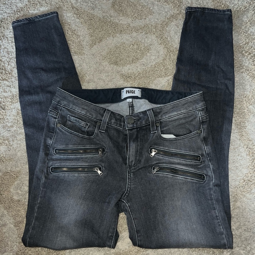 PAIGE skinny jeans with zipper pockets.